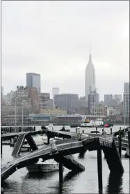  ?? CHARLES SYKES/ ASSOCIATED PRESS ?? The wind warped and twisted a marina on the Hudson River in Hoboken, N.J., a state that took a direct hit from the storm.