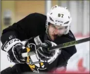  ??  ?? Pittsburgh Penguins team captain Sidney Crosby shoots the puck during practice at the UPMC Lemieux Sports Complex in Cranberry, Pa., Wednesday. The Penguins host the Nashville Predators in Game 5 of the NHL Stanley Cup hockey finals tonight.