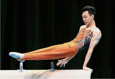  ??  ?? Making the cut: Malaysian artistic gymnast Tan Fu Jie in action during the pommel horse competitio­n at the KL SEA Games last month.