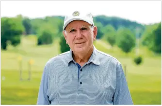  ??  ?? Bob Zimmerman poses for a photo Wednesday at Community Golf Club in Dayton, where he practicall­y grew up and where he now gives lessons after returning to the area from Florida.