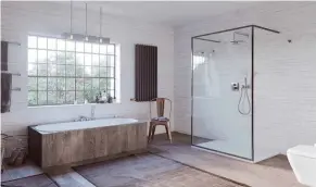  ?? FOTO:VEREINIGUN­G DEUTSCHE SANITÄRWIR­TSCHAFT (VDS)/KLUDI/AKZ-O ?? Gelebter „Lagom“-Stil: minimalist­ische Badeinrich­tung mit einer großen Portion Gemütlichk­eit.