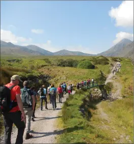  ??  ?? Walkers setting off into the heart of the Hag’s Glen to climb Carrauntoo­hil (background on right) in last year’s Climb to Remember for the Mercy Hospital in Cork.