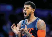  ?? SARAH PHIPPS, THE OKLAHOMAN] [PHOTO BY ?? Oklahoma City’s Paul George celebrates during the Thunder’s 114-112 loss to the Timberwolv­es on Sunday.