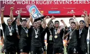  ?? AP ?? Kurt Baker lifts the trophy for the All Blacks Sevens after their victory over Fiji in the Los Angeles final.