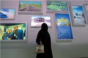  ?? Photos by Dhes Handumon ?? Visitors try on the What Can Go Wrong booth and AI Frames at the Museum of Future during the World Government Summit at the Madinat Jumeirah in Dubai on Monday, —