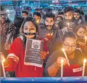  ?? AFP ?? Members of an NGO light candles as they participat­e in a procession calling for justice for the rape, murder case of a 26-year-old veterinari­an, in Siliguri on Saturday.