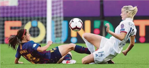  ?? REUTERS PIC ?? Lyon’s Ada Hegerberg (right) in action with Barcelona’s Aitana Bonmati in the women’s Champions League Final on Saturday.