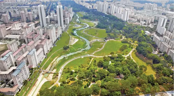  ??  ?? An aeriel view of Bishan-Ang Mo Kio Park and surroundin­g urban green lungs in Singapore.