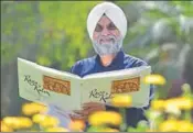 ?? GURPREET SINGH/HT ?? Lensman Tej Pratap Singh Sandhu with his book at his residence in Ludhiana on Tuesday.