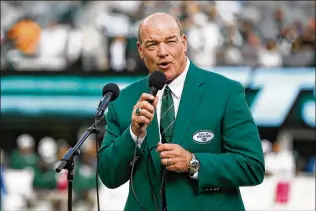  ?? ASSOCIATED PRESS ?? Former New York Jets defensive lineman and longtime team radio analyst Marty Lyons ( speaking at a ceremony in 2013) started the Marty Lyons Foundation in 1982, after the most emotionall­y tough week of his life. “In a matter of six days, I was challenged,” Lyons said.