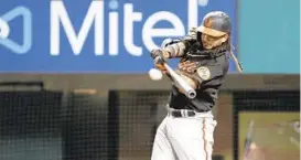  ?? ROGER STEINMAN/AP ?? The Orioles’ Freddy Galvis hits a double during the fifth inning against the Texas Rangers in Arlington, Texas, on Friday.