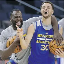  ?? BEN MARGOT/ THE ASSOCIATED PRESS ?? Golden State Warriors’ Draymond Green, left, and Stephen Curry laugh ahead of the NBA Finals. Curry says LeBron James once told him to be ready for special playoff moments.