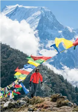  ??  ?? Below Leon Hiro Davis with Manaslu, the world’s eighth tallest mountain, rising behind