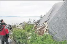  ?? CONTRIBUTE­D PHOTO ?? Heather MacLeod-Leslie is shown taking part in temporary erosion-control efforts on the shores of the Bras d’Or Lake in 2009.