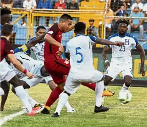  ??  ?? Nick of time: US striker Bobby Wood (centre) scoring a late equaliser against Honduras during the World Cup qualifier on Tuesday.