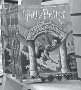  ?? ALEX WONG/GETTY IMAGES ?? Copies of author J. K. Rowling’s Harry Potter books sit in a bookstore in Arlington, Va., in 2000. The fourth book in the series, “Harry Potter and the Goblet of Fire,” was due for release just after midnight July 8 that year.