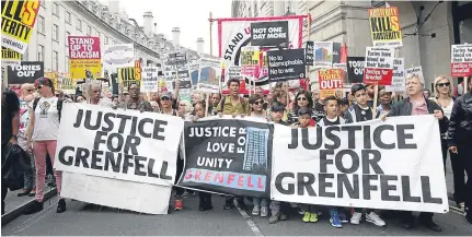  ??  ?? ■
Protesters took to the streets in London yesterday demanding justice for those affected by the fire.