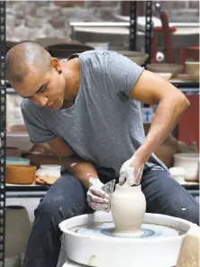  ??  ?? Landon, who teaches workshops around the globe, focuses on elegant shapes, light lines and muted colors for his pottery.