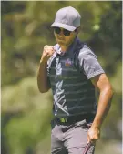  ?? CRAIG FRITZ/FOR THE NEW MEXICAN ?? Taos High School’s Josh Fambro reacts to sinking his final putt to clinch the boys Class 4A State Individual Championsh­ip.