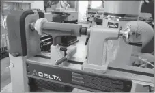  ?? ROGER YIP ?? This medium-sized benchtop woodturnin­g lathe is one of a category called “midi lathes”. It combines the power to do large turnings with the finesse and small size of smaller models.