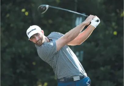  ?? AP PHOTO ?? Dustin Johnson hits his tee shot on the 11th hole during the first round of The Players Championsh­ip on Thursday in Ponte Vedra Beach, Fla.