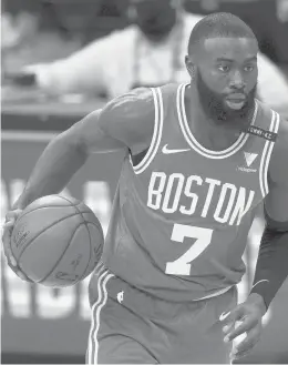  ?? CHRIS SZAGOLA/AP ?? Celtics guard Jaylen Brown dribbles up the court during the second half against the 76ers on Wednesday in Philadelph­ia. The 76ers won 117-109.