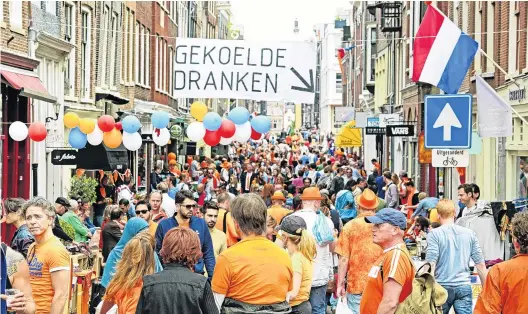  ?? PHOTOS: GETTY IMAGES ?? Party time . . . King’s Day celebratio­ns in the streets of Amsterdam.