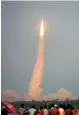  ?? — AFP ?? Onlookers watch as Isro’s GSLV- F08, carrying the GSAT- 6A communicat­ion satellite, blasts off from Sriharikot­a on Thursday.