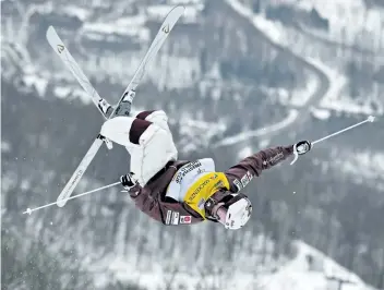  ?? JACQUES BOISSINOT/THE CANADIAN PRESS ?? Mikael Kingsbury, of Deux-Montagnes, Que., jumps during his run Saturday at a World Cup moguls event in MontTrembl­ant, Que. Kingsbury placed second in the event, ending his streak of 13 straight wins. Kingsbury’s streak of podium finishes is now at 16....