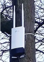  ??  ?? Proud: Rob Anderson, pictured with family, set up Wi-Fi in his village, above