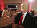  ?? JOE RAEDLE / GETTY IMAGES ?? Florida’s GOP Gov. Rick Scott greets backers at his election night party at a resort in Naples, Florida. He led Democratic Sen. Bill Nelson in a tight Senate race facing a recount.