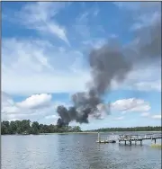  ?? AP/KENSLEY CROSBY ?? Smoke billows at the site where a military jet crashed Friday in Beaufort, S.C., near its base.