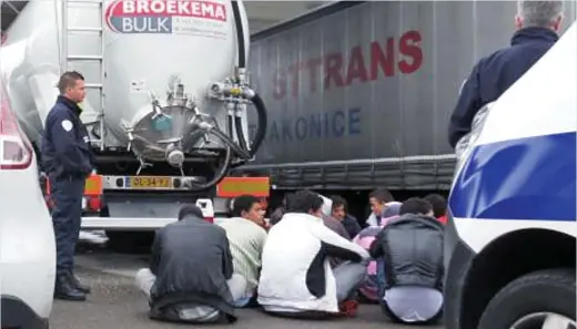  ??  ?? Caught out: A group of 16 immigrants was found in a tanker that was filling up at a Calais petrol station on Saturday