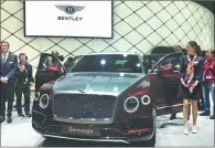  ??  ?? Bentley unveils its first plug-in hybrid model, Bentayga Hybrid, at the Geneva auto show.