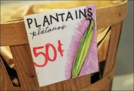  ?? PHOTOS BY LAUREN HALLIGAN — LHALLIGAN@ DIGITALFIR­STMEDIA. COM ?? Plantains for sale at the produce market.