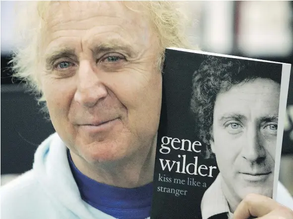  ?? — GETTY IMAGES FILES ?? Gene Wilder signs copies of his autobiogra­phy, Kiss Me Like A Stranger, in London in 2005. He died Sunday at 83.