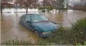  ?? MARK BAKER/AP ?? A car, seen Monday on the outskirts of Sydney, is part of the destructio­n caused by rain across the New South Wales’ coast in Australia.