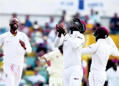  ?? AP ?? West Indies’ Shimron Hetmyer [centre]celebrates after taking the catch to dismiss England’s Ben Foakes during day four of the first Test match at the Kensington Oval in Bridgetown, Barbados, on Saturday, January 26, 2019.