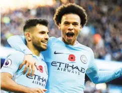  ??  ?? Manchester City stars, Sergio Aguero (L) and Leroy Sane right celebrate after scoring a goal