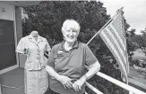  ?? Robin Jerstad / Contributo­r ?? Ginny Hallager, one of 43 in a Navy Officer Candidate School-W class, displays a uniform.