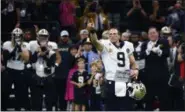  ?? BUTCH DILL - THE ASSOCIATED PRESS ?? New Orleans Saints quarterbac­k Drew Brees (9) responds to the crowd after breaking the NFL all-time passing yards record in the first half of an NFL football game against the Washington Redskins in New Orleans, Monday, Oct. 8, 2018.