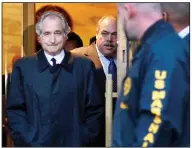  ?? (AP) ?? Bernie Madoff leaves U.S. District Court in Manhattan after a bail hearing in New York in January of 2009.