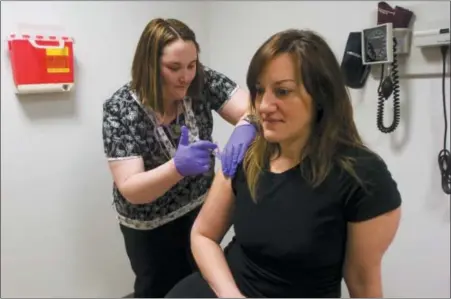  ?? DIGITAL FIRST MEDIA FILE PHOTO ?? Noel Walden receives a flu shot from nurse Jessica Frey-Shive. “I’ve already had a cold a few times this year and when they asked if I wanted a shot I figured I should get it this time,” said Walden, 43. “Last time I had a flu shot was six years ago.”