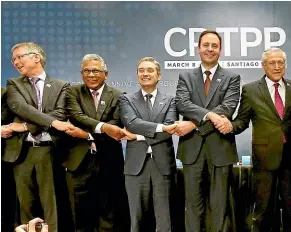  ?? AP ?? Trade and Export Growth Minister David Parker, left, at the signing of the CPTPP in Santiago, Chile.