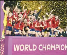  ?? Associated Press ?? Team Spain celebrates after winning the Women’s World Cup soccer final against England, 1-0, on Sunday at Stadium Australia in Sydney, Australia.