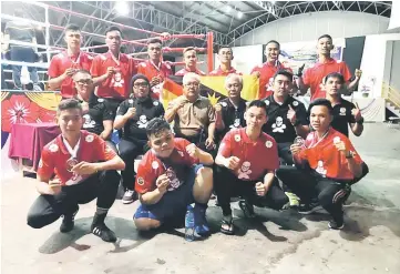  ??  ?? Rahman (seated third left) with the state boxers, coaches and officials after the prize presentati­on.