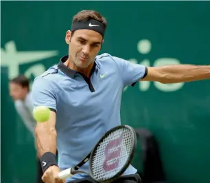  ?? — PTI ?? Roger Federer plays a backhand return to Germany’s Alexander Zverev in the final in Halle.