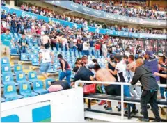  ?? AFP ?? Supporters of Atlas fight with supporters of Queretaro during the Mexican Clausura tournament football match on March 5.