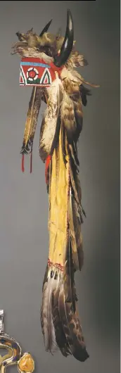  ??  ?? Above, Jicarilla Apache headdress, circa 1870, Collection of the Colorado Springs Fine Arts Center; left, Snake Pendant by Eveli Sabatie, circa 1990