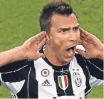  ??  ?? Mario Mandzukic celebrates his stunning opening goal for Juve.